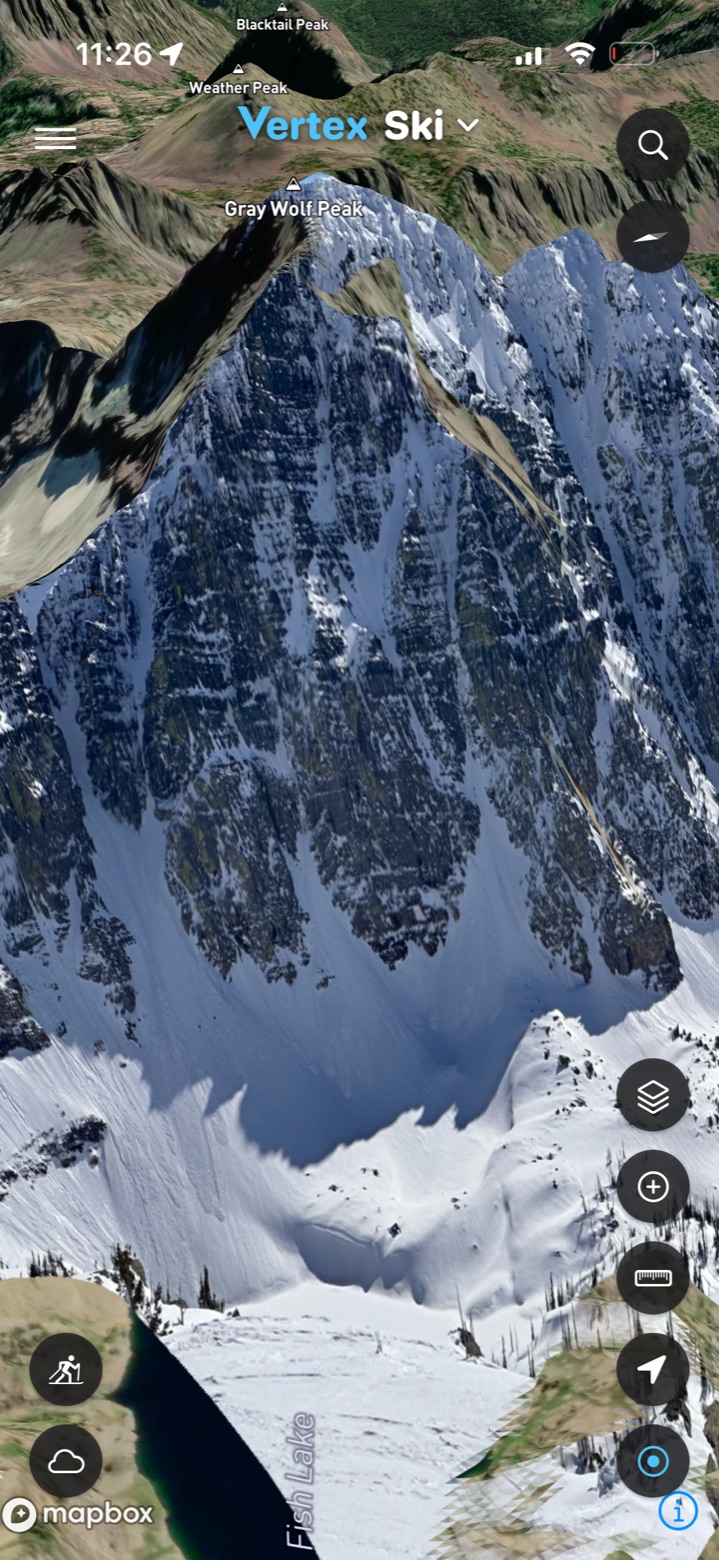 A photo of a snowy peak aligned to the 3D terrain as a basemap